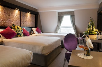 Quad Room – One Double and Two Single Beds