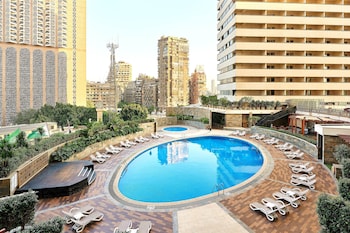 Deluxe Guest room, 1 King, Pool & City view, Balcony