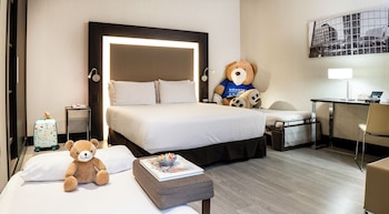 Standard Room with one Queen bed and two child beds
