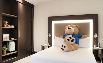 Standard Room with one Queen bed and two child beds
