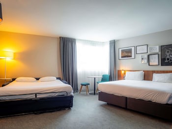 Junior Suite with Eiffel Tower View, 1 double bed and a double sofa bed.