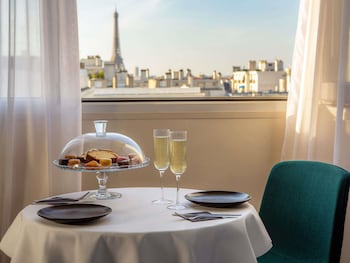 Junior Suite with Eiffel Tower View, 1 double bed and a double sofa bed.